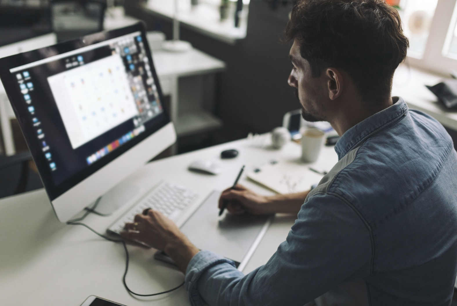 Designer working at computer in modern office