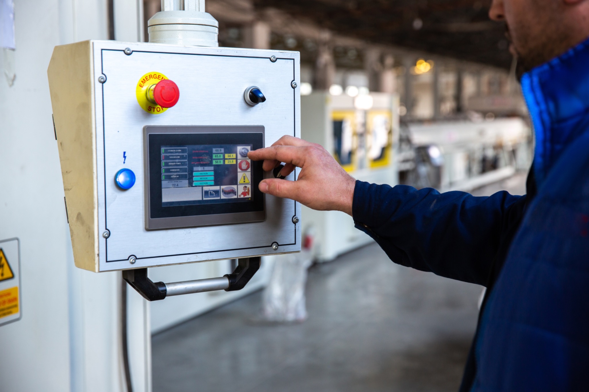 Operator using factory control panel